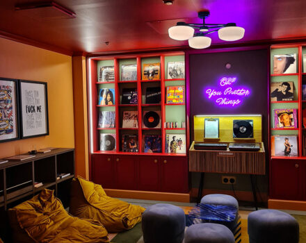 hotel lounge with neon sign on the wall